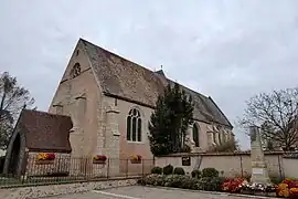 Façade ouest et son porche-caquetoire, mur sud.