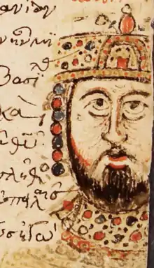 Photographie de la marge d'une page de manuscrit, montrant l'esquisse du portrait d'un homme barbu et couronné.