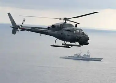 AS-555 de la marine colombienne se préparant à tirer.