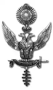 photo en noir et blanc d'un bijoux maçonnique avec deux aigles en apposition.