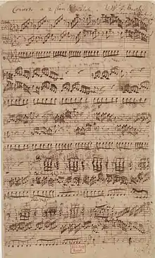 Partition manuscrite à trois portées.