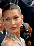 Bella Hadid (à gauche), Kim Kardashian (au centre) et Naomi Campbell (à droite) font partie des noms cités dans la chanson.