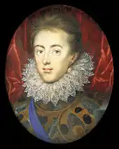 Portrait d'un jeune homme portant une fraise en dentelle et un pourpoint gris et doré.