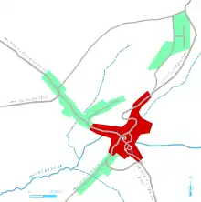 Vue d'une carte en couleur représentant les étapes de développement du bâti d'un bourg.