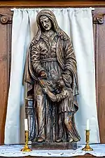 Statue de Sainte Anne apprenant à lire à la Vierge.