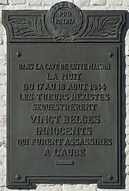 Plaque apposée sur la maison où furent détenues les victimes.