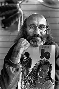 Derib posant avec un exemplaire de Jo