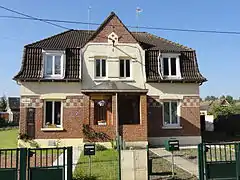 Habitations groupées par deux.