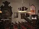 Vue de l'intérieur de l'église des Capucins d'Ostende avec une maquette de corvette du XVIIIe siècle.