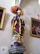Statue de saint Nicolas et les trois petits enfants au baquet dans l'église