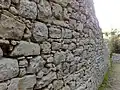 Muraille de la cité d'Eryx en Sicile avec réutilisation d'une base antérieure (IVe – IIIe siècles av. J.-C.).