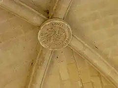 Clé de voûte du porche,LOVIS PETIT MAIRE 1869.