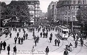Le tramway Enghien - Trinité devant l'actuel théâtre Gérard-Philipe. On voit ici la sortie des ouvriers de l'usine Delaunay-Belleville.