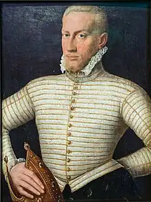 Portrait d'un homme d'âge moyen, vêtu d'un costume beige.