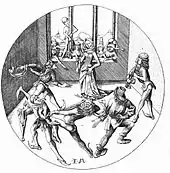 Des hommes dansant forment un cercle autour d'une femme