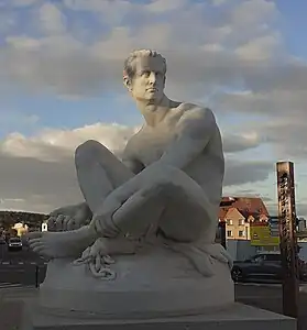 Exilé (1877), Louviers, place Ernest-Thorel.