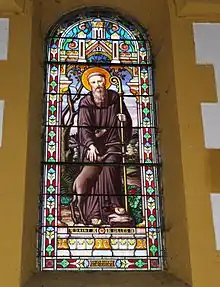 Le vitrail représentantsaint Gilles.