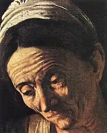 Détail du tableau, gros plan sur le visage de la vieille femme.