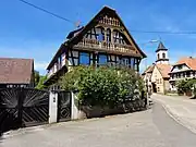 Ferme (XIXe siècle) (Maison "Schini" : pignon avec loggia à deux niveaux).