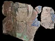 Couple richement paré. Scène de la prédication du Bouddha. Kucha, Duldur-āqur, sanctuaire du nord-est. Xinjiang. Peinture murale, début du VIe siècle. Musée national des Arts asiatiques - Guimet, Paris.