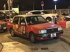 Taxi Toyota Crown Comfort G.P.L. à Hong Kong.