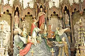 Relief de l'offrande de l’église par Saint Nicolas au Sacré-Cœur.