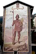 Fresque dédiée à saint Maurice sur la place du marché, avec la devise « en adversité, bon cœur », ajoutée au blason de la ville en 1565 par le duc Emmanuel-Philibert