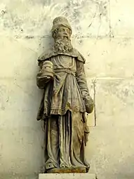 Statuette d'un homme barbu avec des pains.