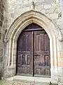 Porte XVIe siècle entrée par le bas-côté nord.