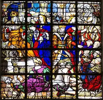 Élément de vitrail. Deux scènes sont représentées. A gauche, un homme couronné sur un trône discute avec une femme blonde. A leurs pieds gisent la tête et le corps d'une femme. A droite, le même homme fait face à de nombreux hommes agenouillés, suppliants. La même femme blonde se tient debout à ses côtés, parlant aux hommes à genoux.