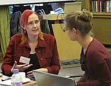 Suw Charman-Anderson speaking to a person.