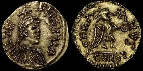 Tiers de sou d'or de Childebert Ier.Avers : Buste diadémé à droite, une croisette sur la tête.Revers : Victoire debout à droite tenant une couronne. Bibliothèque nationale de France.