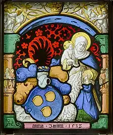 Vitrail représentant une femme debout tenant un bébé dans la main et l'autre main sur l'épaule d'une petite femme elle-même debout